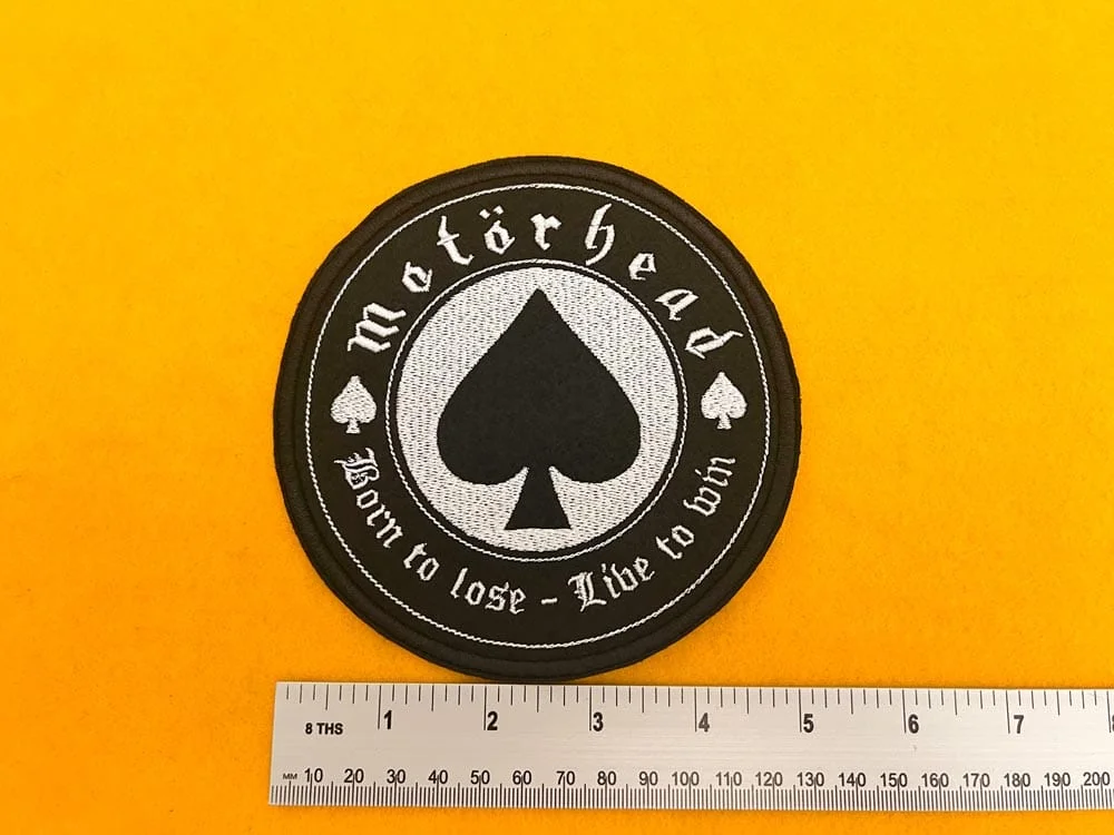 Motörhead embroidered band patch beside measurement ruler