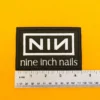 Small medium and large Nine Inch Nails patch size comparison