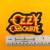 Embroidered Ozzy Osbourne design beside measurement ruler