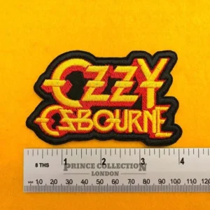Embroidered Ozzy Osbourne design beside measurement ruler