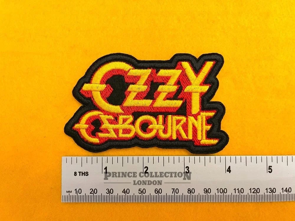 Embroidered Ozzy Osbourne design beside measurement ruler