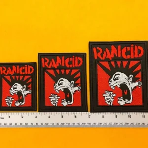 Rancid embroidered band patch on denim punk jacket