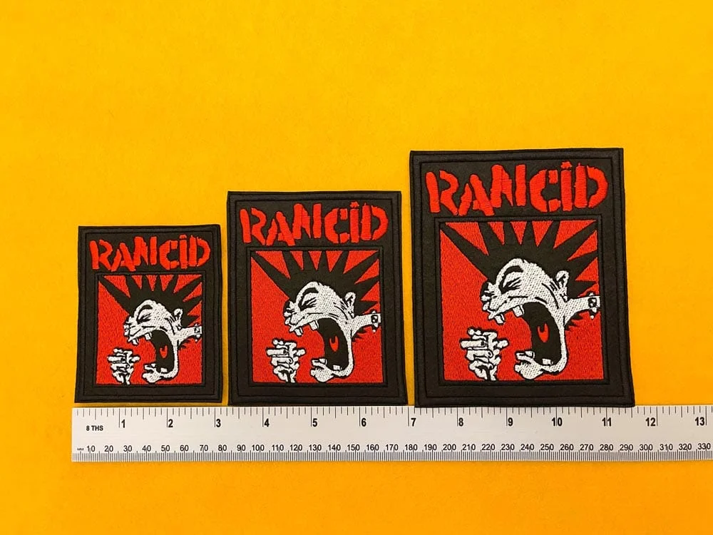 Rancid embroidered band patch on denim punk jacket