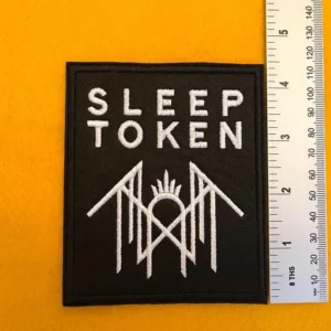 Embroidered Sleep Token design beside measurement ruler