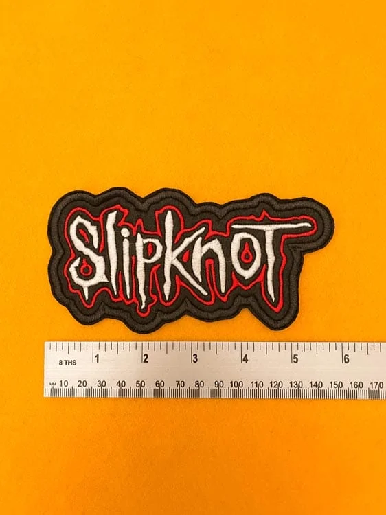 Embroidered Slipknot logo beside measurement ruler